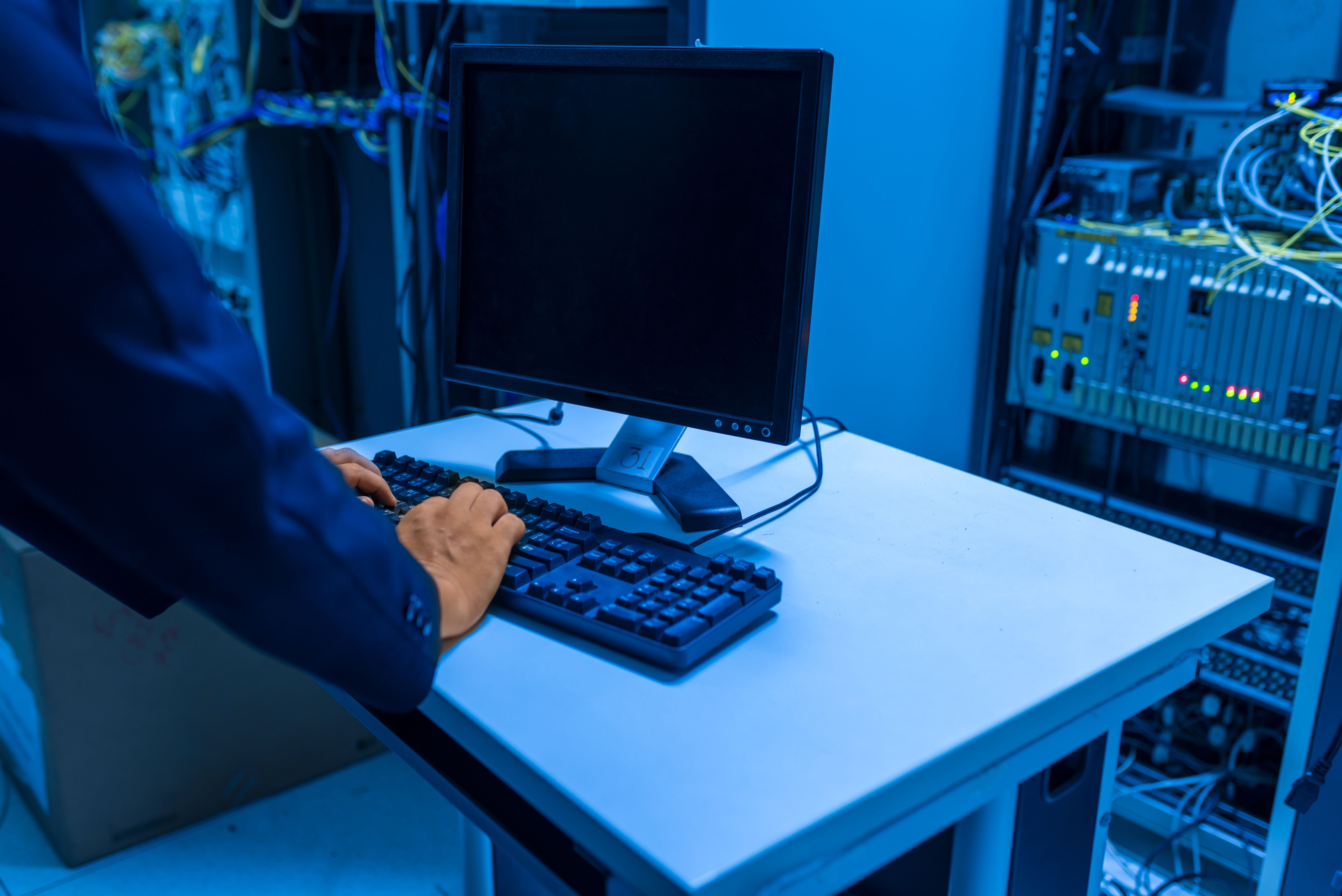 Security professional monitoring servers in a data center